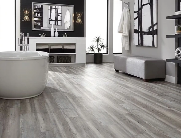 Hardwood versus luxury vinyl plank flooring comparison for residential and commercial spaces in Warwick and Cumberland RI