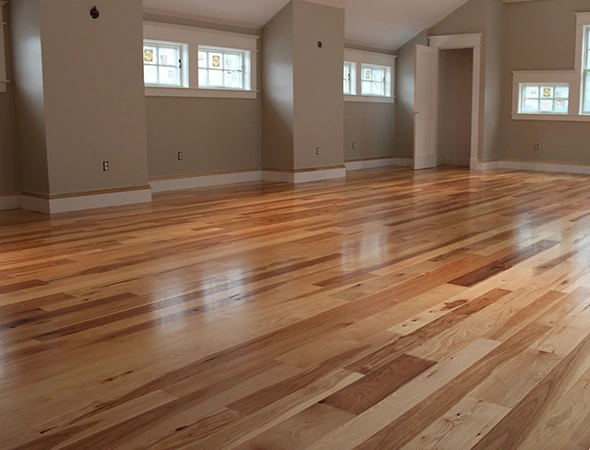 Luxury vinyl plank flooring installation with herringbone pattern design in Warwick RI home